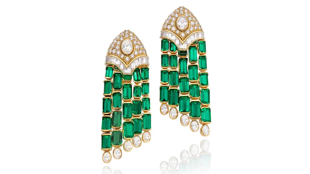 A pair of Bulgari earclips each with step-cut emeralds weighing approximately 13.55 carats and 13.64 carats mounted in 18-karat yellow gold. Bulgari emerald and diamond earclips